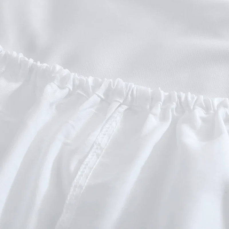 Sábana bajera ajustable blanca